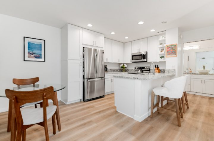 Updated white kitchen with stainless appliances